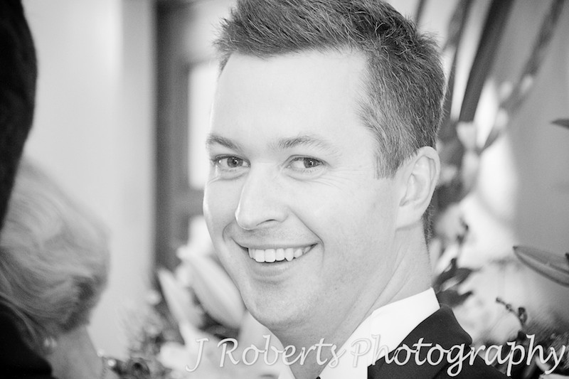 groom all smiles before the ceremony starts - wedding photography sydney